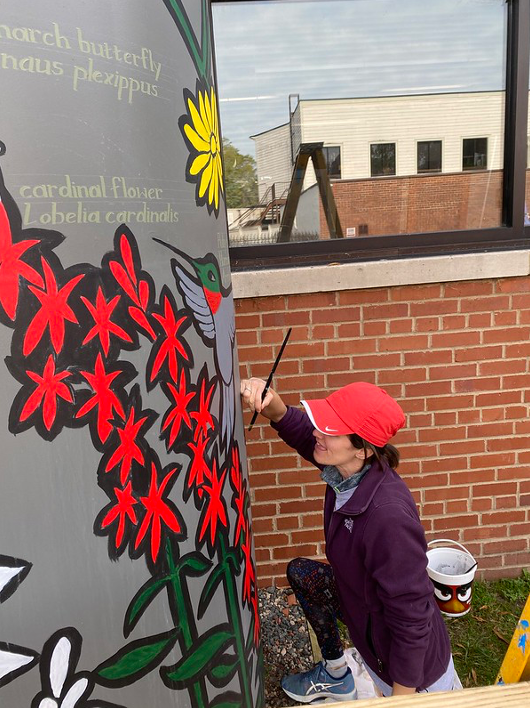undercoating the lighter colors with white paint.
