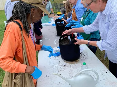 Bucket Brigade Image from previous event. Features attendees and grow buckets!