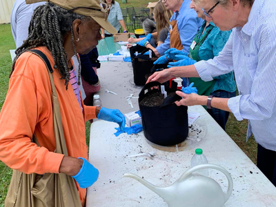 Bucket Brigade Image from previous event. Features attendees and grow buckets!