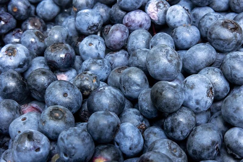 A close up of a pile of blueberries.