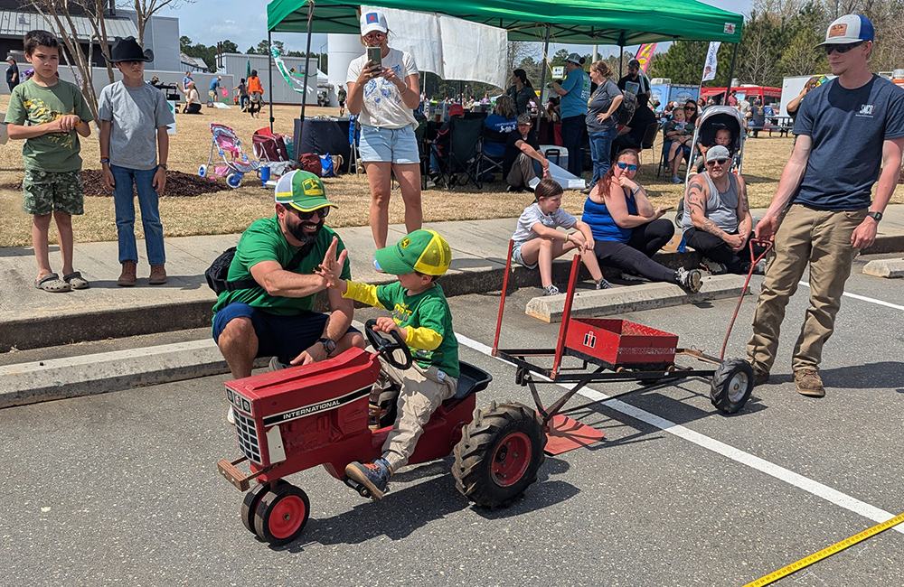 The kids had fun at the pedal tractor pull.