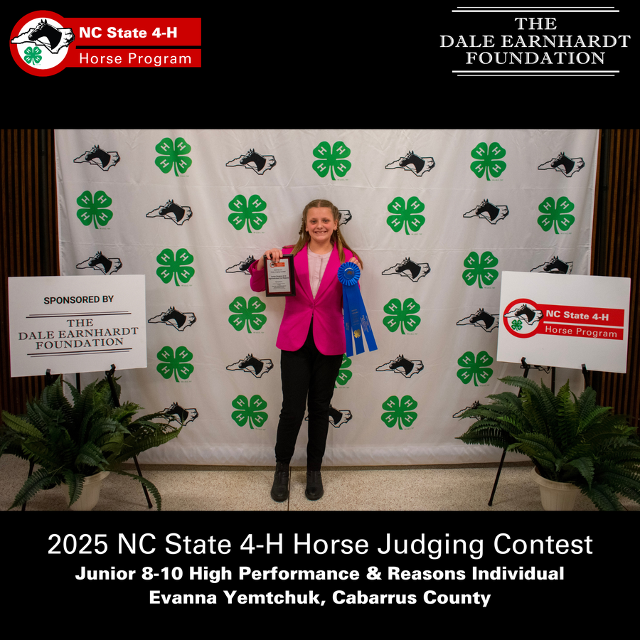 Girl holding plaque and blue ribbons at 2025 NC State 4-H Horse Judging Contest