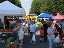 Attendees at Farmers Market Shopping for Food