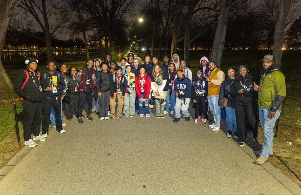 A group of 4-Hers pose together near the reflecting pool in Washington D.C.