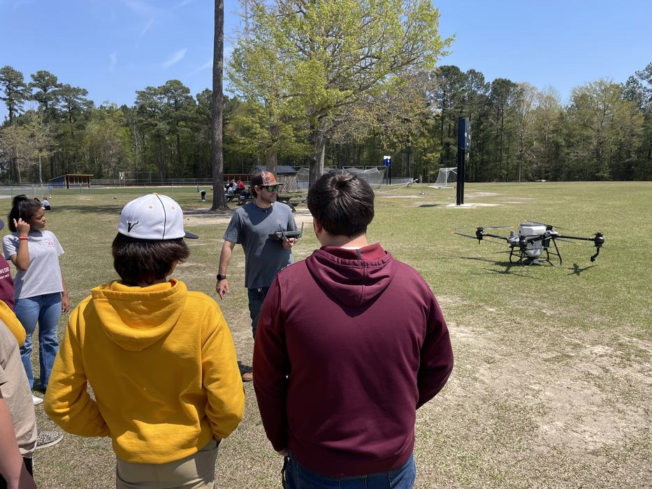 A man demonstrates a large drone.