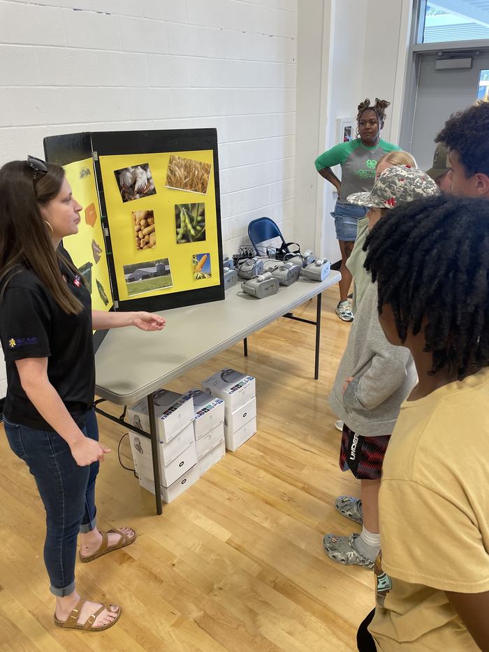 Children learn from a display on crops.