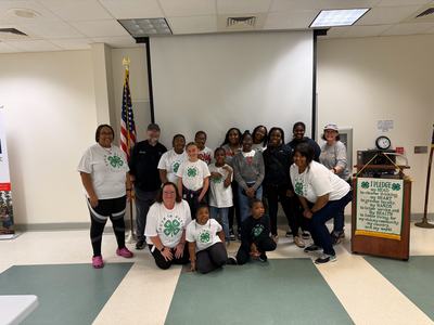 EFNEP Educator Angie Lawrence with Chef John LaTour group photo with 4-H Youth in Action