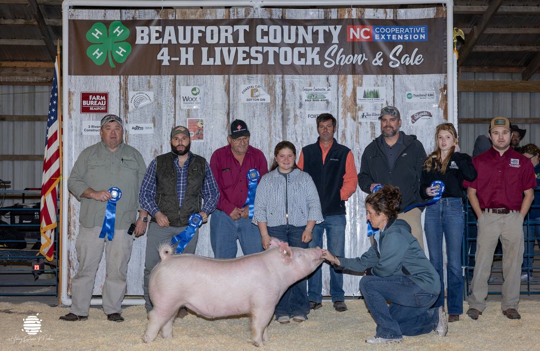youth with animal and buyers