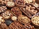 A variety of nuts in wooden bowls. Healthy food.