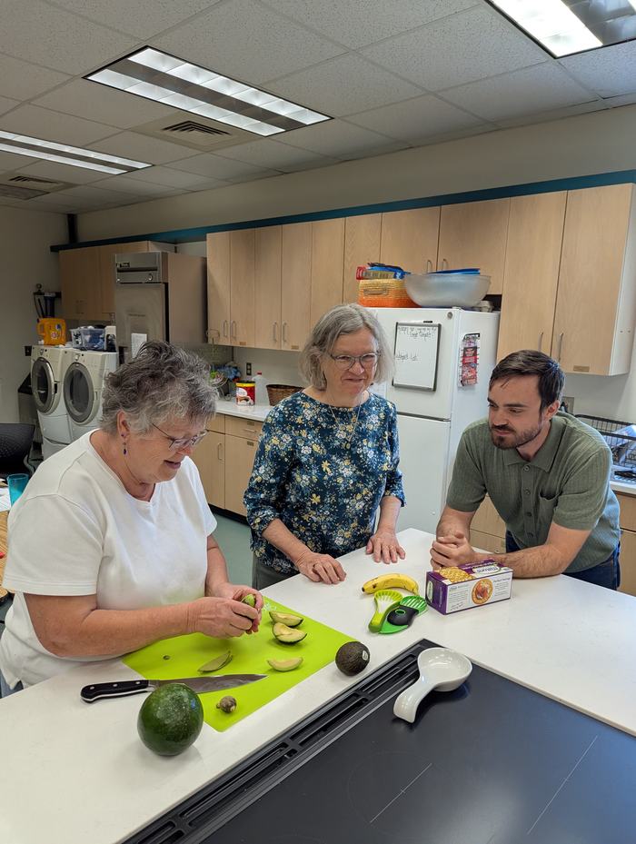 Extension Master Food Volunteers with Family & Consumer Science agent Avery Ashley, cutting avocados 