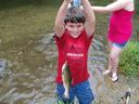 boy fishing with trout