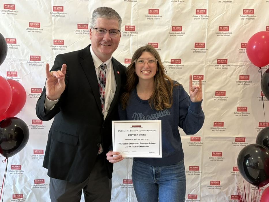 image of Leelee holding a certificate and posing with Dean Garey Fox