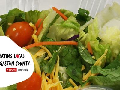 Salad with cherry tomatoes and cheese; badge: Celebrating Local Food, Gaston County (NC State Ext.)