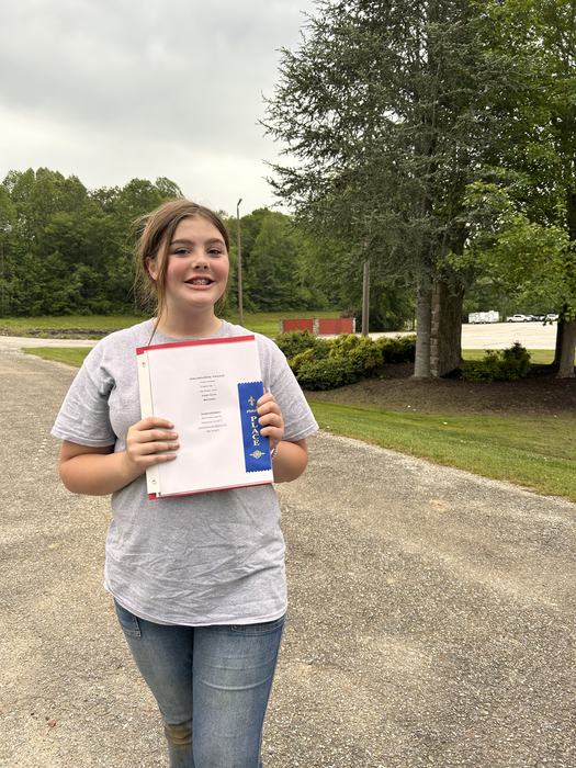 Photo of girl holding blue ribbon and horse poem