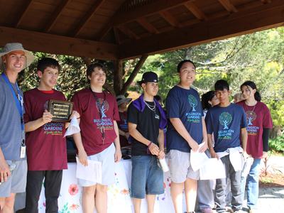 Students stand together to receive awards.