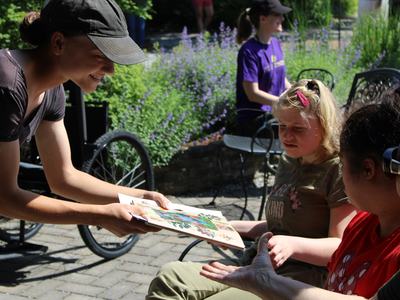 A child receives a piece of paper.