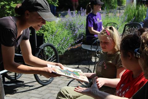 A child receives a piece of paper.