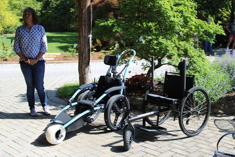 Two mobility devices in a garden.