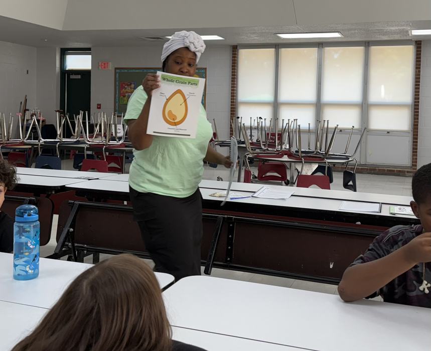 LaGronda Mitchell, after-school instructor and cafeteria staff member at Lincoln Elementary YMCA Southeastern teaching kids about Eat Smart Move More program