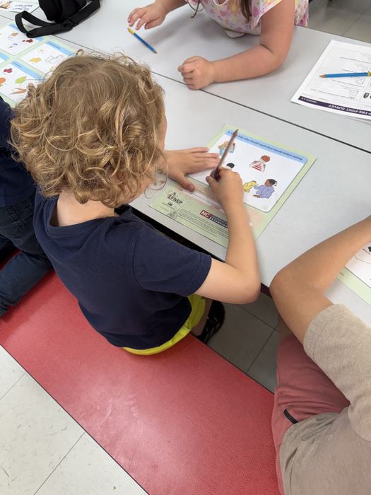 A child fills out a worksheet.