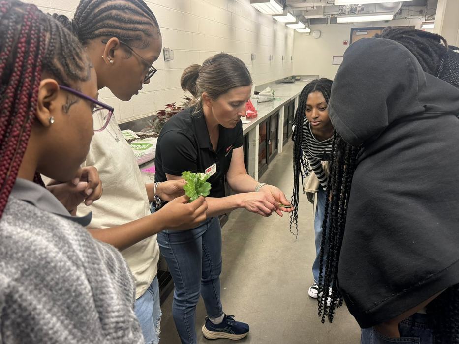 a group of students in a plant lab.