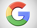 Multicolored Google "G" logo (red, yellow, green, blue) on light gray background