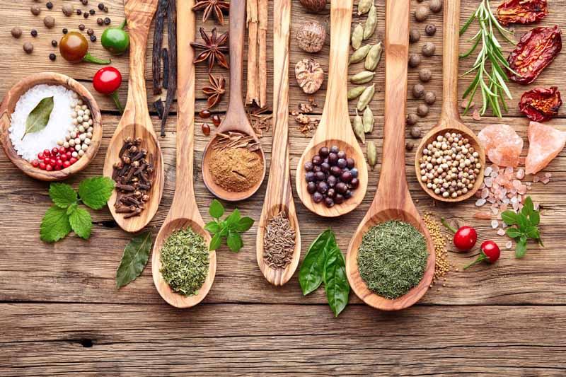 Herbs and spices laid out on a table.