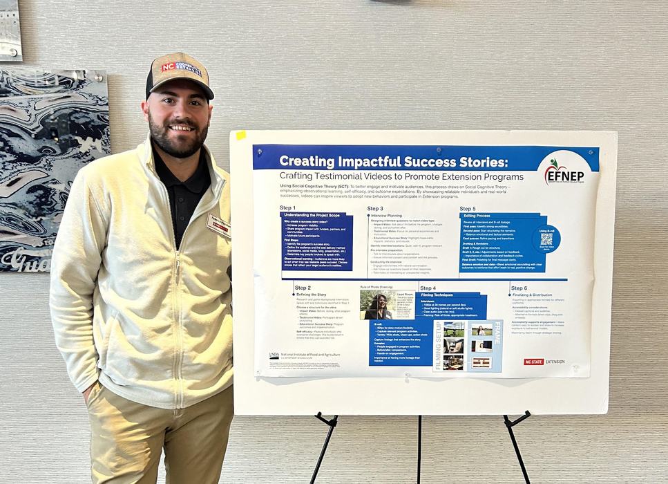 Man standing beside poster titled "Creating Impactful Success Stories: Crafting Testimonial Videos"