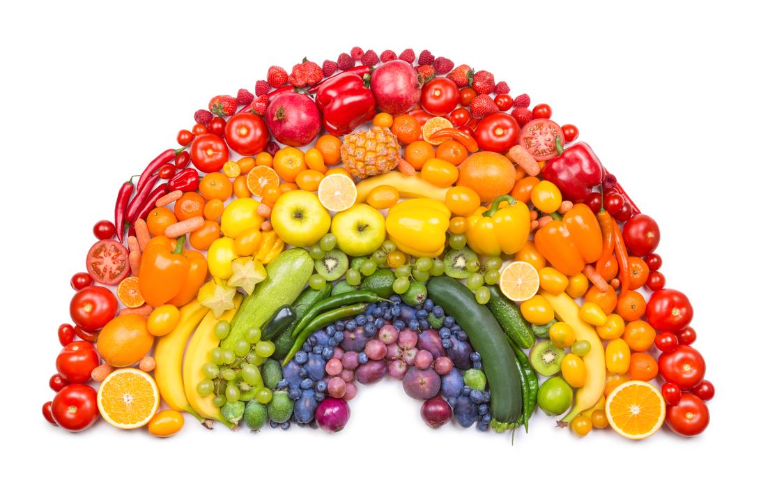 A rainbow made from an arrangement of fruits and vegetables.