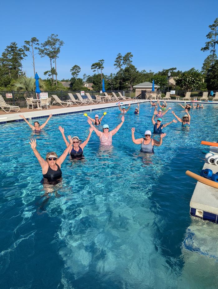 people exercising in a pool