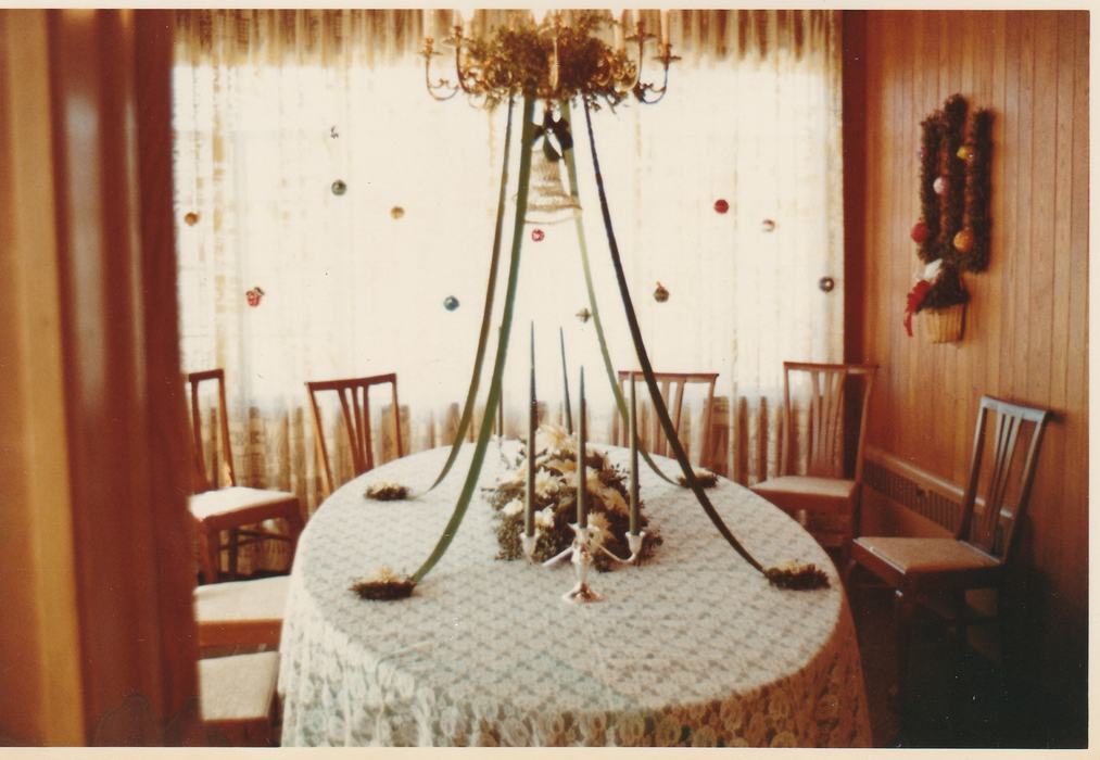 Governor's Western Residence decorated by Buncombe County Extension Homemakers, 1972. Dining table and chairs in front of decorated windows.