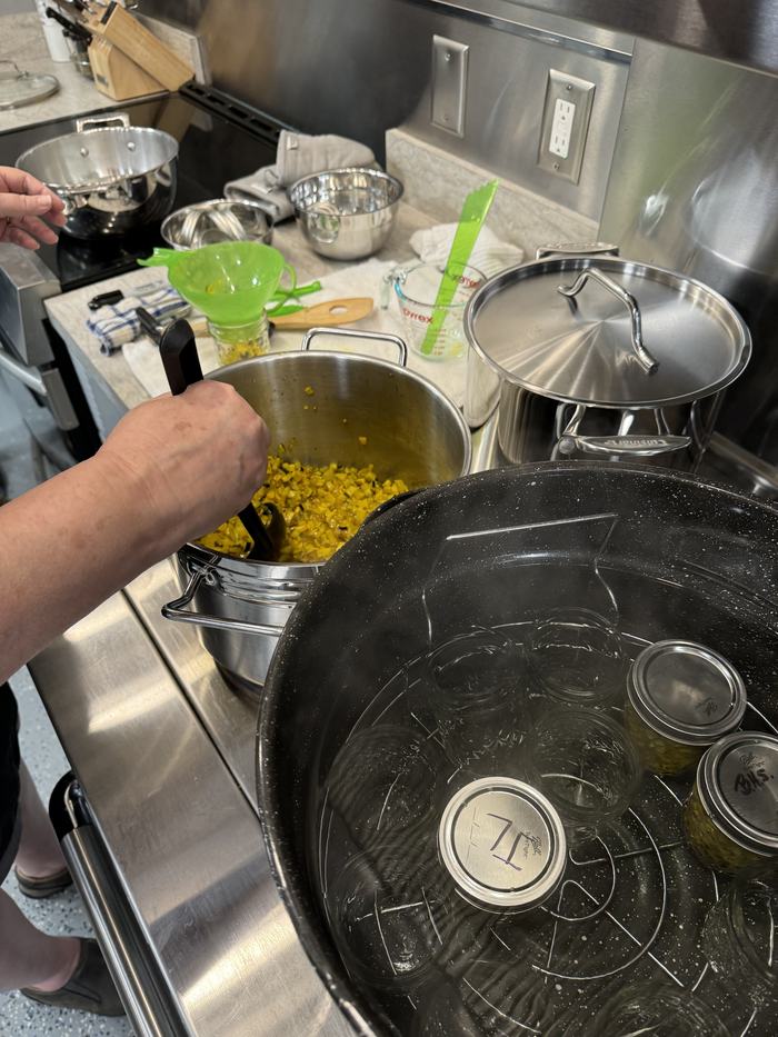 filling relish jars and putting in water bath canner on stove