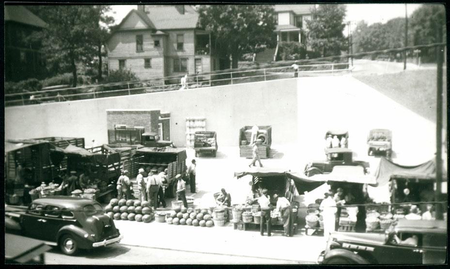 Black and white photo of the Lexington Avenue Curb Market in 1940s. 