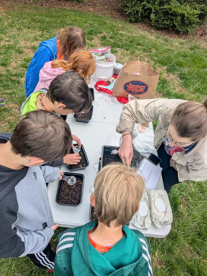youth participating in outdoor STEM learning