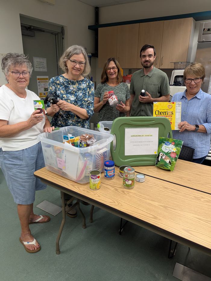 People demonstrate canned goods and other shelf stable ingredients.