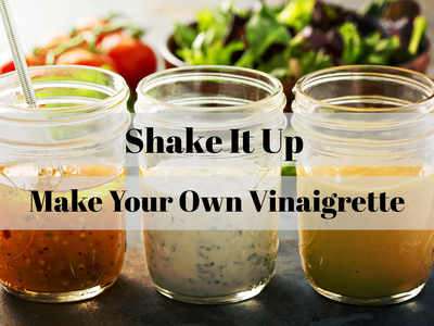 Three mason jars of vinaigrettes with overlaid text "Shake It Up Make Your Own Vinaigrette"