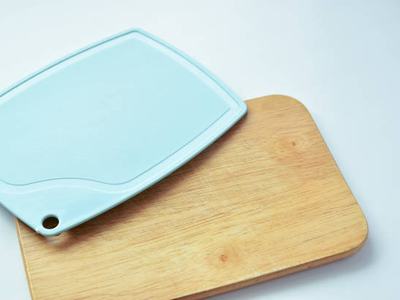 plastic and wooden cutting board