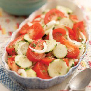 A summer salad made of onions, cucumbers and tomatoes. 