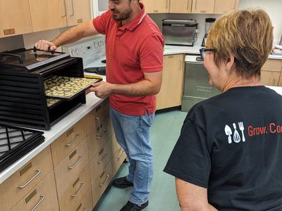 Preserving food using a dehydrator in a test kitchen.