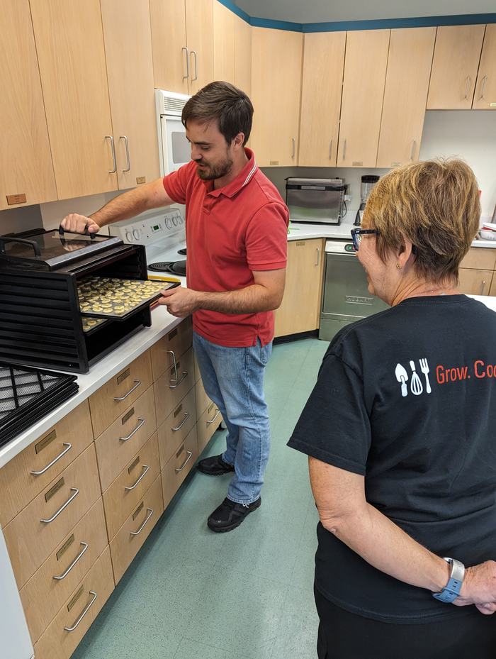 Preserving food using a dehydrator in a test kitchen.