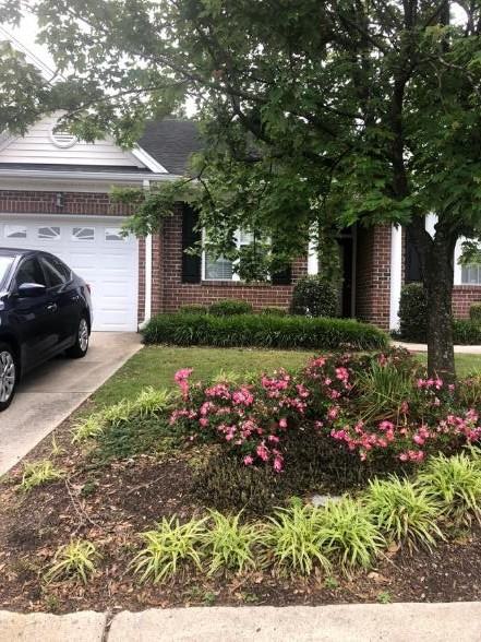 Downspout example that could be disconnect from the driveway and diverted to the lawn