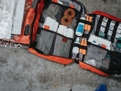 picture of an emergency supplie kit with first aid items and other needed supplies