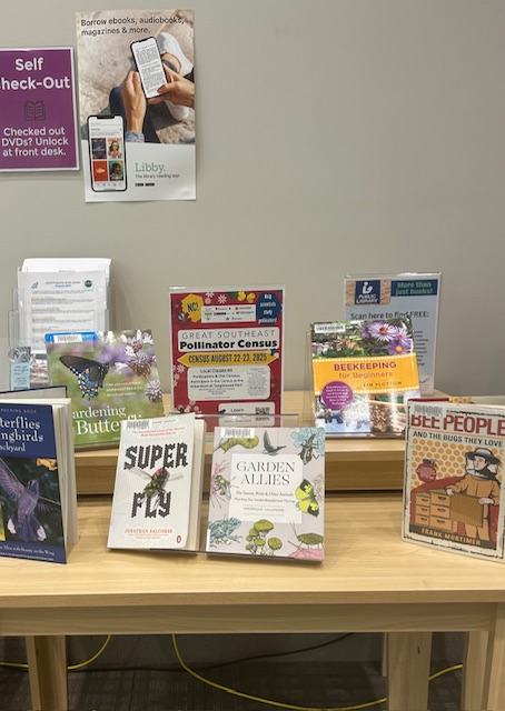 Image of display about Pollinators. Display includes book recommendations and a flyer about the Great Southeast Pollinator Census. Display is housed at the Paddison Memorial Branch Library in Kernersville.