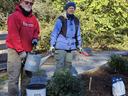 Paco and Betsy planting shrubs