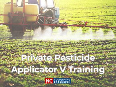 Tractor spraying a field