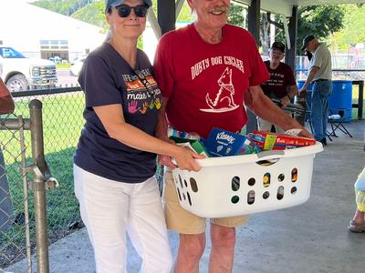 Teacher receives basket of school supplies