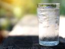 a glass with ice and water in it