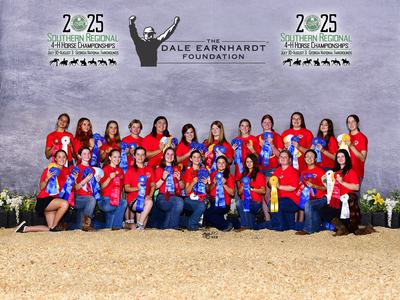 Group of 4-H members in red shirts holding ribbons at 2025 Southern Regional 4-H Horse Championships