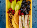 sandwich fruit and bar in a lunch box