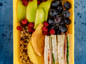 sandwich fruit and bar in a lunch box